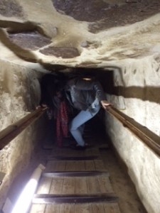 Jennifer squeezing through the tunnels